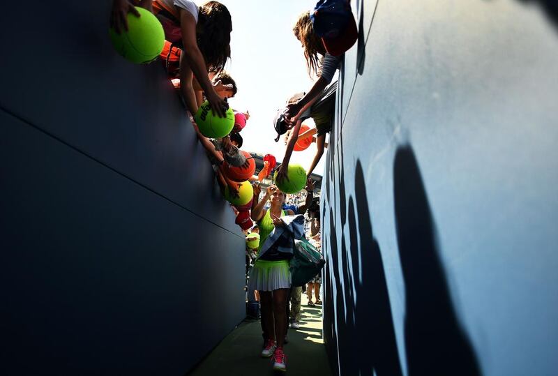 Roberta Vinci (centre) of Italy signs autographs as she leaves the court after defeating Lesia Tsurenko of Ukraine during their 2016 US Open Women’s Singles match at the USTA Billie Jean King National Tennis Centre in New York. AFP