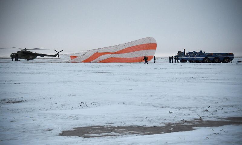 A search and rescue team works on the site of landing of the Soyuz MS-06 space capsule with International Space Station crew members Joe Acaba and Mark Vande Hei of the US, and Alexander Misurkin of Russia in a remote area outside the town of Dzhezkazgan (Zhezkazgan), Kazakhstan. Alexander Nemenov / Reuters