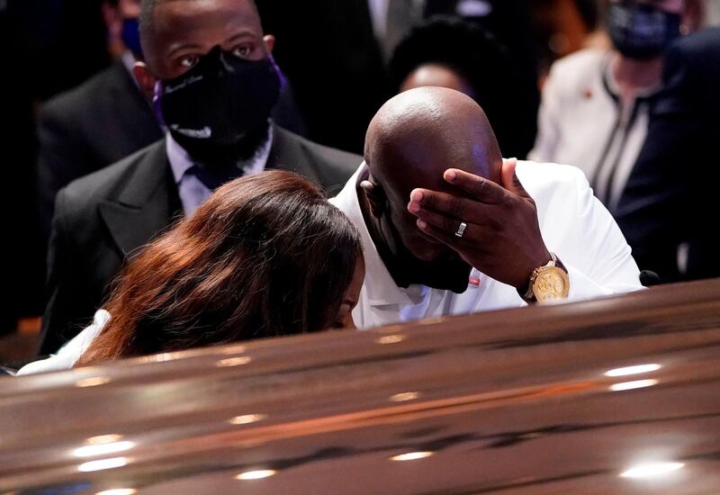 Philonise Floyd, brother, of George Floyd pauses at the coffin during the funeral.  AFP