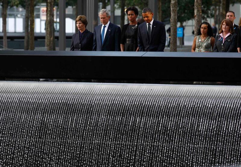 U.S. President Barack Obama and first lady Michelle Obama are joined by former President George W. Bush and his wife Laura Bush during ceremonies marking the 10th anniversary of the 9/11 attacks on the World Trade Center in New York, September 11, 2011.  REUTERS/Jim Young   (UNITED STATES - Tags: DISASTER ANNIVERSARY TPX IMAGES OF THE DAY) *** Local Caption ***  WTC816_SEPT11-_0911_11.JPG