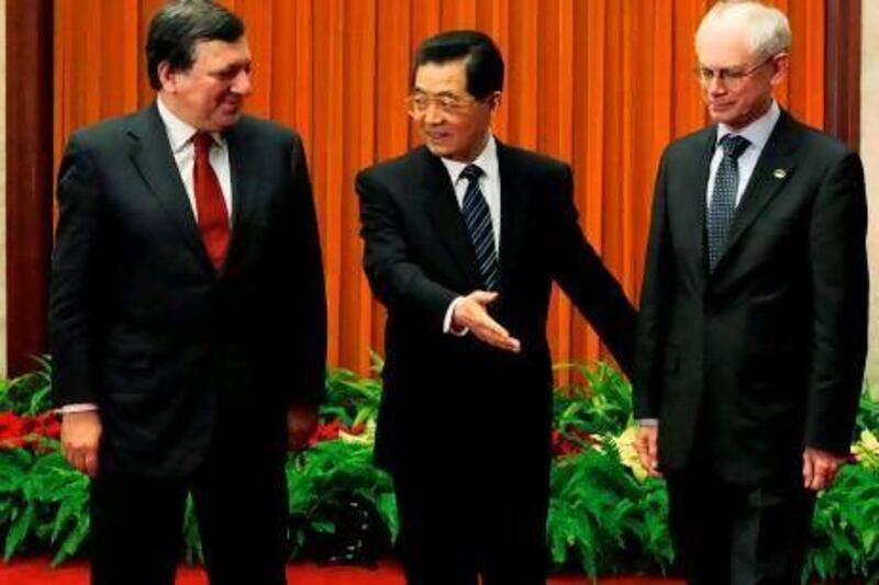 The European Council president Herman Van Rompuy, right, and the European Commission president Jose Manuel Barroso, left, are in China to promote their embattled economy to its president Hu Jintao and others.