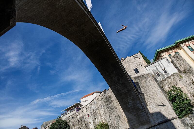 A competitor dives from Stary Most (meaning Old Bridge) during the 454th traditional diving competition on Sunday, July 26, 2020 in Mostar, Bosnia and Herzegovina. Getty
