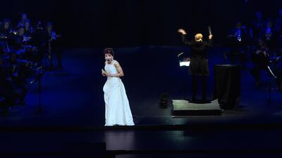 This AFP TV video frame grab shows the hologram of Maria Callas singing on stage during an hologram-concert at the Salle Pleyel, in Paris, on November 28, 2018. - Opera diva Maria Callas "returns" to the stage - as a hologram during the show 'Callas - The Hologram Show', which is shown until November 30, 2018 at the Salle Pleyel in Paris, 41 years after the singer's death. (Photo by Natalie HANDEL / AFP)