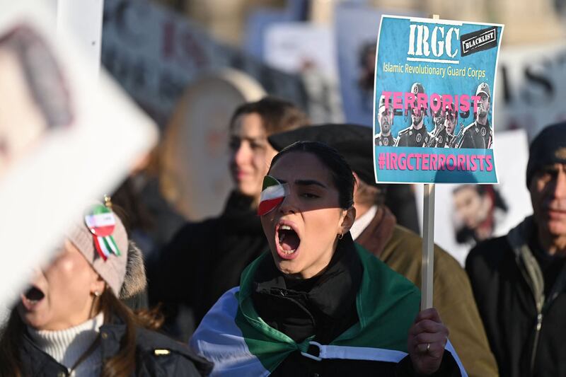 People march in London, to show solidarity with Iranian protesters, as the UK government faces renewed calls to step up its response to Tehran. AFP