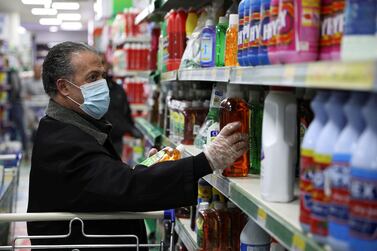 A shopper wears a mask at a supermarket in Amman. Reuters