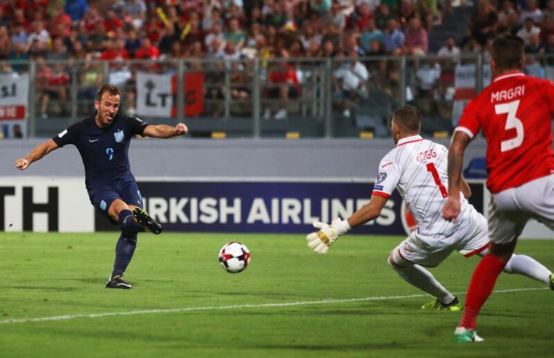 VALLETTA, MALTA - SEPTEMBER 01:  Harry Kane of England scores their first goal past Andrew Hogg of Malta during the FIFA 2018 World Cup Qualifier between Malta and England at Ta'Qali National Stadium on September 1, 2017 in Valletta, Malta.  (Photo by Julian Finney/Getty Images)