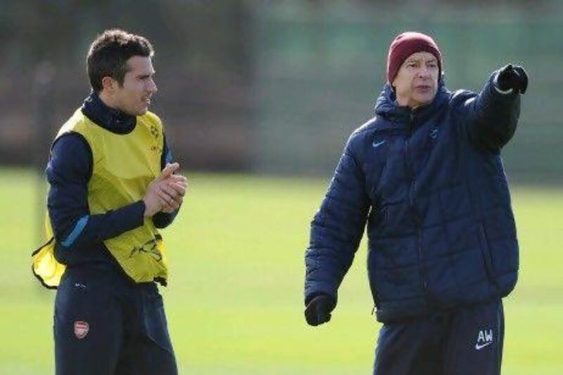 Arsene Wenger, right, is confident Robin van Persie will remain an Arsenal player after the end of the season.