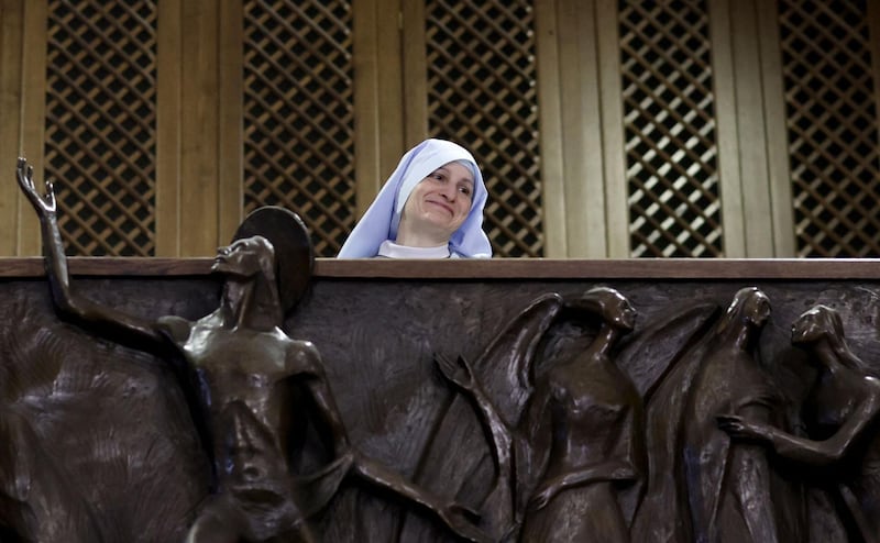 A Catholic nun plays the organ during an Easter mass. Traditional hymns are often sung during this annual celebration. AFP