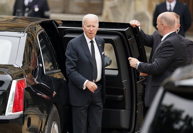 US President Joe Biden arrives for the funeral. PA