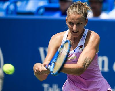 epa06949850 Karolina Pliskova of the Czech Republic in action against Agnieszka Radwanska of Poland in their match in the Western & Southern Open tennis tournament at the Lindner Family Tennis Center in Mason, Ohio, USA, 14 August 2018.  EPA/PHILLIP WRIGHT