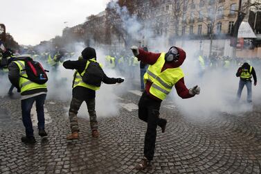 Yellow Vests protesters hurl back tear gas to French riot police during a demonstration in Paris, France, 17 November 2018. The group are planning their 41st Saturday demonstration in Biarritz this weekend during the G7 summit.EPA/IAN LANGSDON