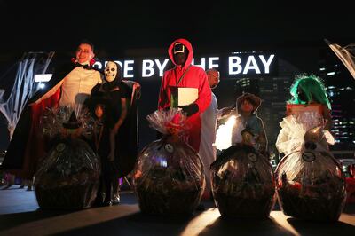 Participants dressed up in costumes during the Halloween Run held at Dubai Festival City Mall, on October 30, 2021. Pawan Singh / The National