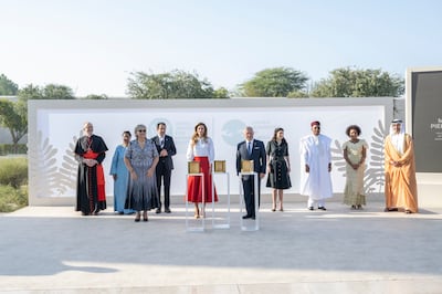 King Abdullah and Queen Rania of Jordan, and Michele Pierre-Louis, founder of Fokal, attend the ceremony for the Zayed Award For Human Fraternity at The Founders Memorial. Hamad Al Kaabi  / Ministry of Presidential Affairs
