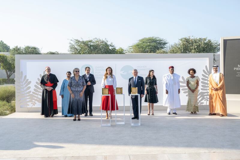 King Abdullah II and Queen Rania of Jordan, and Michele Pierre-Louis, founder of Fokal, attend the ceremony for the Zayed Award for Human Fraternity at the Founder's Memorial. Photo: Hamad Al Kaabi  / Ministry of Presidential Affairs