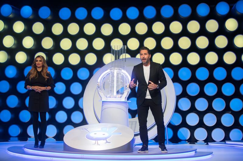 Aishwarya Ajit and Wissam Braidy host the Mahzooz live draw at Studio City. Ruel Pableo / The National