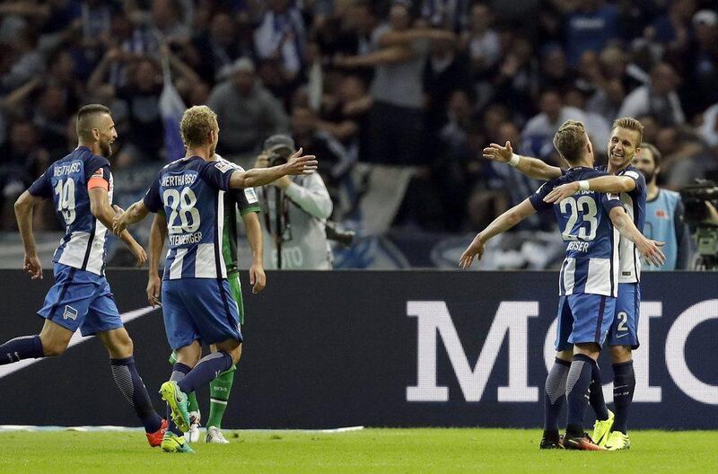 Hertha Berlin’s Mitchell Weiser, second right, and his teammates celebrate a goal in their Bundesliga win on Sunday. Michael Sohn / AP Photo