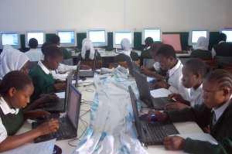 OCTOBER 2009, NAIROBI, KENYA: Students practice in a computer lab at Kibra Academy in Nairobi. For many of the underprivileged kids, these are the first computers they have used. The 30 computers were donated by Computers for Schools Kenya, a technology charity. Of the 1.2 million high school students in Kenya, only one quarter have access to computers. The Kenyan government wants all students to have access to a computer. MATT BROWN/THE NATIONAL *** Local Caption ***  Computers 1.JPG