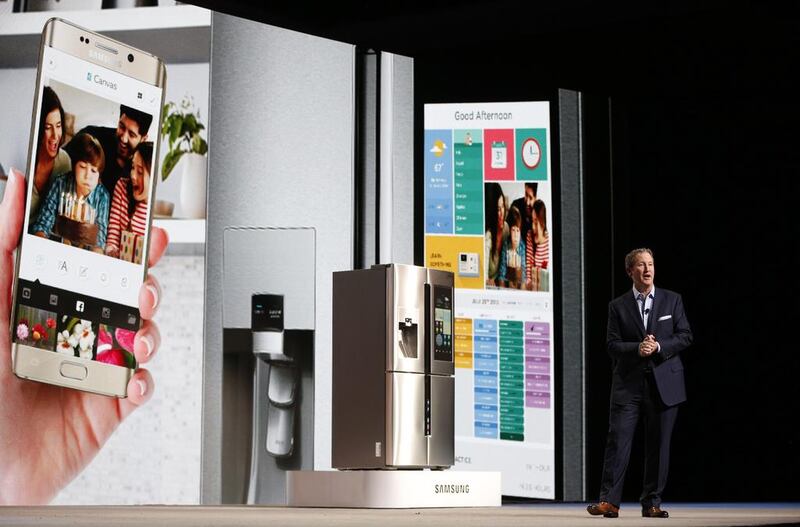 John Herrington, senior vice president of Samsung Electronics America, unveils the Family Hub refrigerator during an event at the 2016 Consumer Electronics Show. Patrick Fallon / Bloomberg