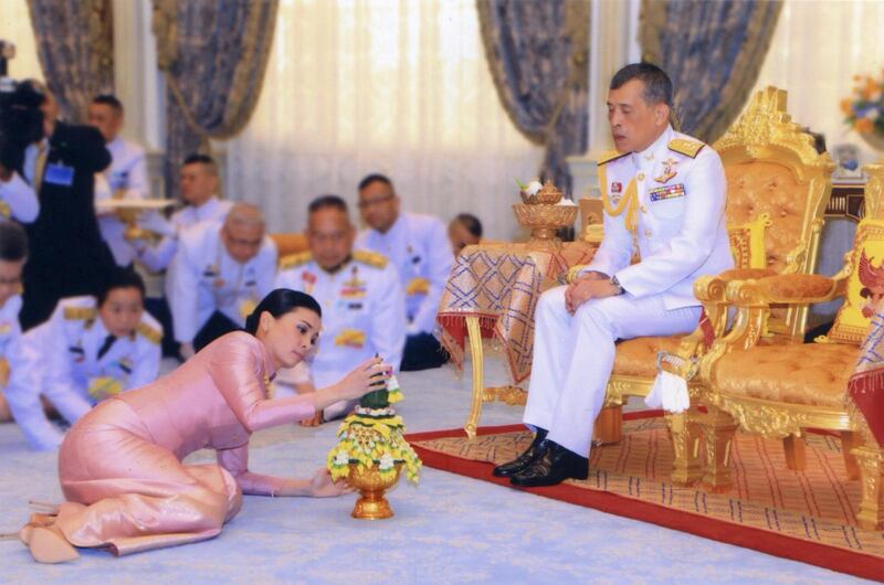 King Maha Vajiralongkorn and his consort, Queen Suthida, perform a traditional ritual at their wedding ceremony in Bangkok. All photos by Reuters