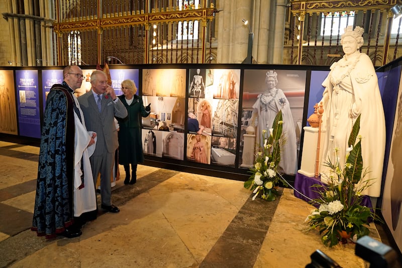 King Charles and the Queen Consort Camilla are shown a scaled replica of the statue inside York Minster. Getty Images