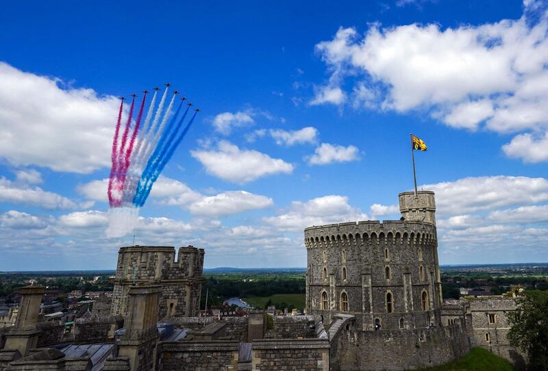 The Red Arrows conduct a flypast during a military ceremony to mark Britain's Queen Elizabeth II's official birthday at Windsor Castle. AFP