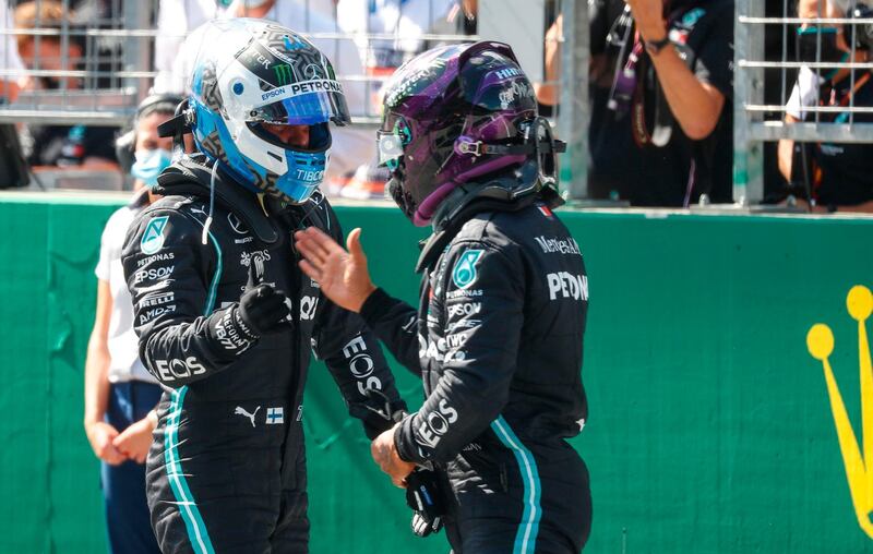 Mercedes' Lewis Hamilton congratulates teammate Valtteri Bottas after qualifying. AFP