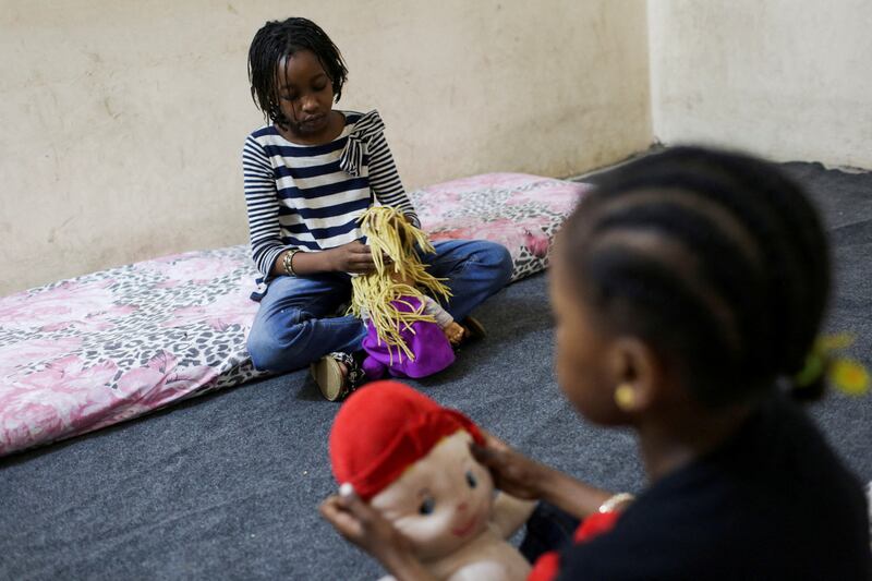 Sisters Talia and Talien, who fled with their family from their home in Sudan's capital Khartoum, at a shelter in Giza, Egypt. Reuters