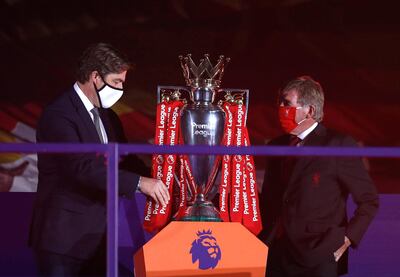 LIVERPOOL, ENGLAND - JULY 22: Richard Masters, Chief Executive of Premier League and Sir Kenny Dalglish, Former Captain and Manager of Liverpool place The Premier League trophy upon a plinth following the Premier League match between Liverpool FC and Chelsea FC at Anfield on July 22, 2020 in Liverpool, England. Football Stadiums around Europe remain empty due to the Coronavirus Pandemic as Government social distancing laws prohibit fans inside venues resulting in all fixtures being played behind closed doors. (Photo by Phil Noble/2020 Pool)