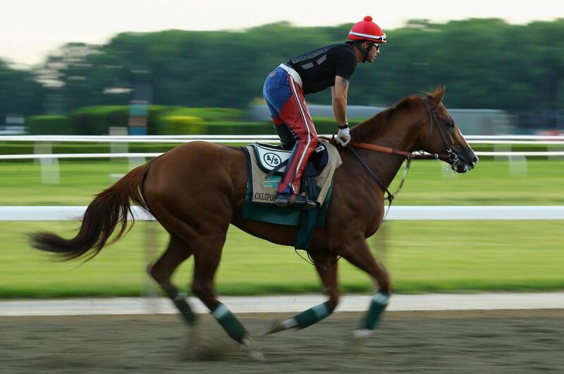 Kentucky Derby and Preakness Stakes winner California Chrome training with exercise rider Willie Delgado at Belmont Park on Tuesday. Al Bello / Getty Images / AFP / May 27, 2014