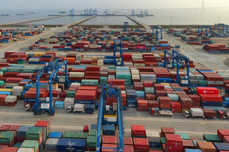 FILE - In this April 8, 2021 file photo, a container port on the Yangtze River is seen in an aerial view in Nantong in eastern China's Jiangsu province. China reported that its April imports and exports surged over the same month in 2020 as global demand strengthens. (Chinatopix via AP, File)