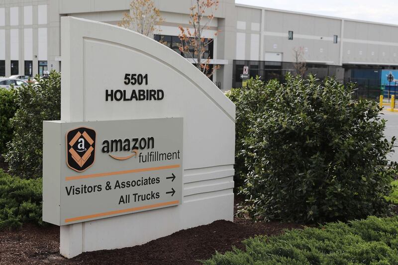 BALTIMORE, MARYLAND - APRIL 14: A sign directs visitors to the 1.2 million-square-foot BWI2 Amazon Fulfillment Center employing about 2500 workers in the Chesapeake Commerce Center April 14, 2020 in Baltimore, Maryland. While some workers across the country have expressed concern about what steps Amazon is doing to protect workers from COVID-19, the online retailer hired 100,000 people in March says it wants to add another 75,000 full and part-time jobs due to rising demand during the coronavirus pandemic.   Chip Somodevilla/Getty Images/AFP
== FOR NEWSPAPERS, INTERNET, TELCOS & TELEVISION USE ONLY ==
