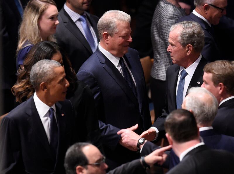 (L-R) Former US President Barack Obama, former US Vice President Al Gore, and former US President George W. Bush arrive for the Memorial Service.  AFP