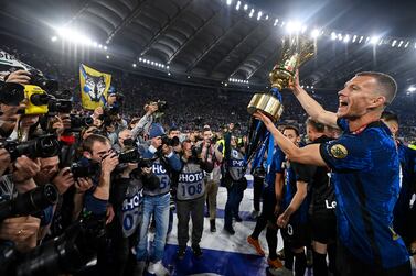 Inter's Edin Dzeko (R) celebrates with the trophy after winning the Coppa Italia Final soccer match between Juventus FC and FC Inter at the Olimpico stadium in Rome, Italy, 11 May 2022.   EPA / Riccardo Antimiani