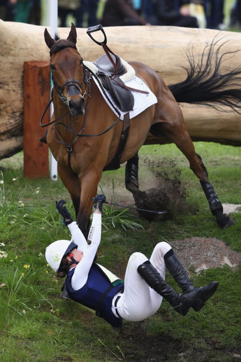 Willa Newton falls off Chance Remark at the 15th fence during the Cross Country test at the Badminton Horse Trials in Gloucestershire, England. Michael Steele / Getty Images