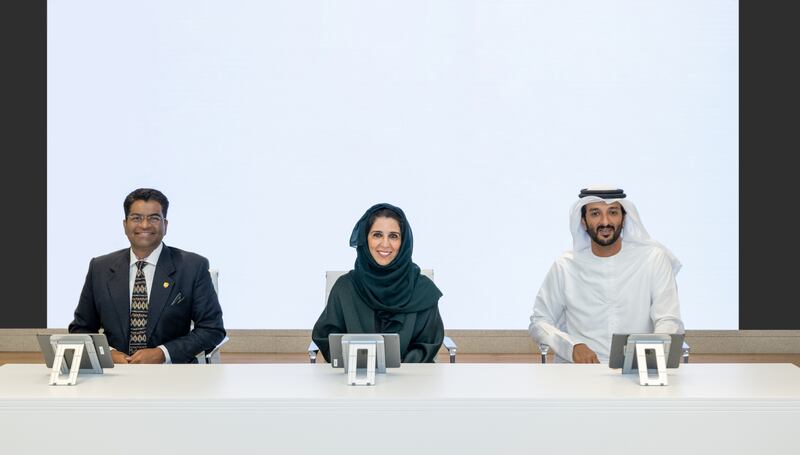 From right, Abdulla bin Touq, UAE Minister of Economy and chairman of the General Civil Aviation Authority; Maryam Al Hammadi, Minister of State and Secretary General of the UAE Cabinet; and Bala Subramanian, UPS chief digital and technology officer, at the unveiling of the UAE Regulations Lab licence for electric cargo aircraft. Photo: Government Media Office