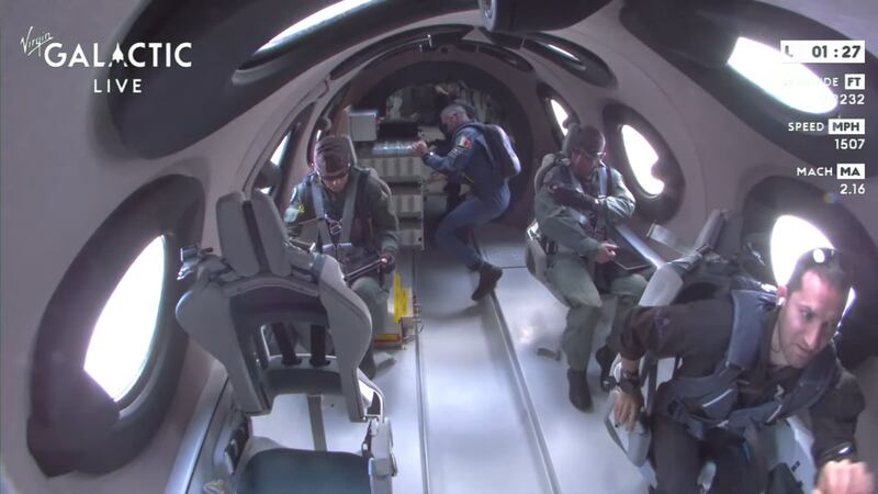 The three Italian passengers and one Virgin Galactic employee seen enjoying microgravity aboard the VSS Unity spaceplane after it reached the edge of space.