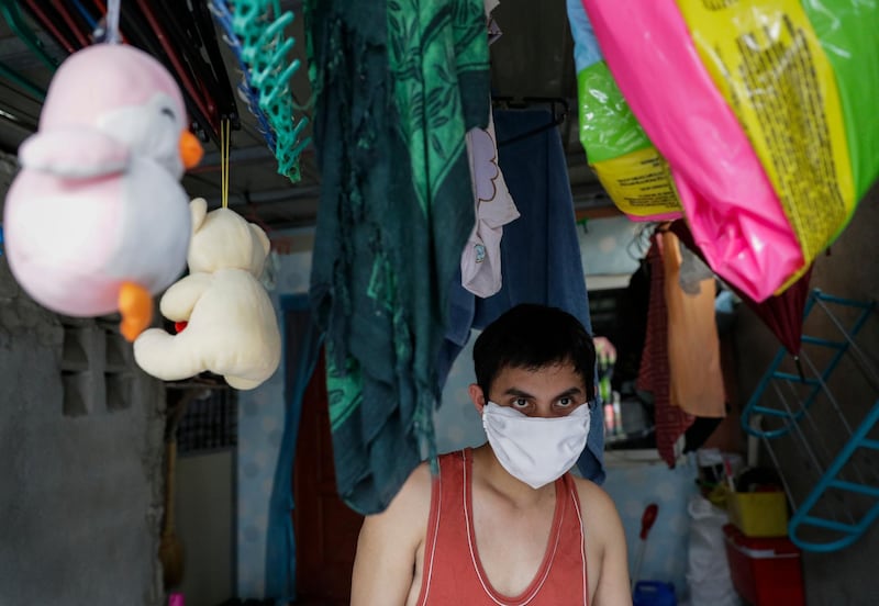 Christopher Bagay, a kitchen crew of the Aida Sol cruise ship in Europe, walks beside children's toys upon arriving at his home in Laguna province, south of Manila, Philippines.AP Photo