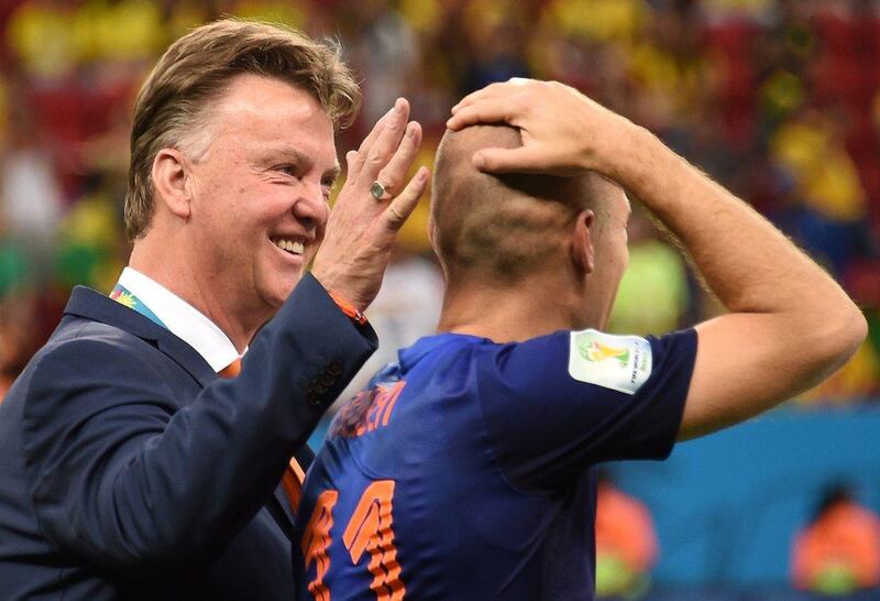 Louis van Gaal and Arjen Robben celebrate after the Netherlands' 3-0 win over Brazil in the 2014 World Cup third-place play-off match on Saturday. Vanderlei Almeida / AFP / July 12, 2014