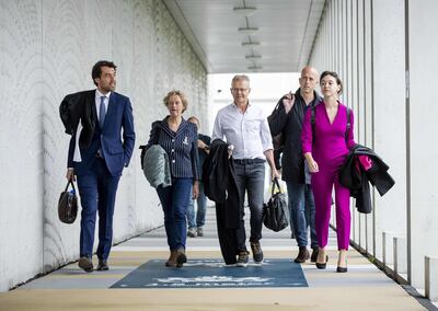 (L/R): Lawyers Juriaan de Vries, Benedicte Ficq, Nico Meijering, Christian Flokstra, Laura ter Steeg (left to right) arrive at an 'extra secure' court at Schiphol, Badhoevedorp, The Netherlands on  August 27, 2020, for a pre-trial hearing in the 'Marengo' case. The case revolves around a series of murders allegedly carried out on behalf of Ridouan Taghi, who was arrested in Dubai in December 2019, and extradited to The Netherlands. - Netherlands OUT
 / AFP / ANP / Sem VAN DER WAL
