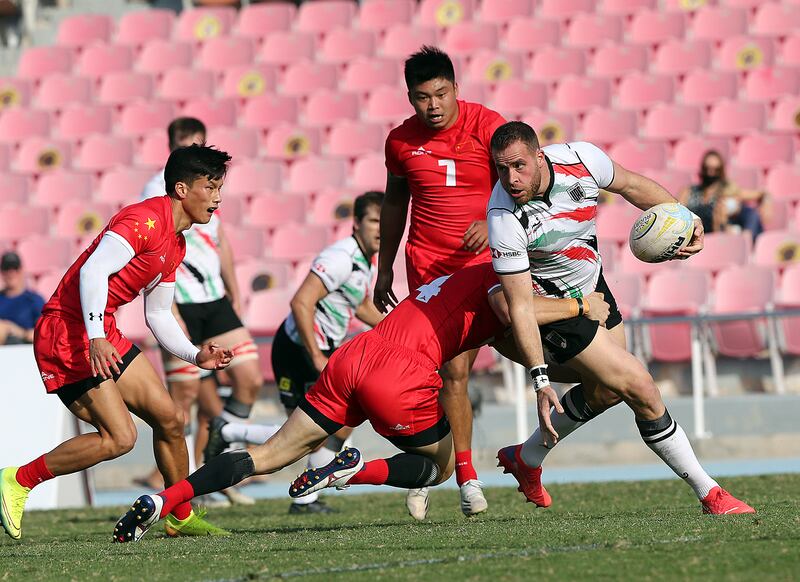 UAE's Jaen Botes attempts to break through a tackle during the national team's 29-17 loss to China in the Dialog Asia Rugby Sevens Series at Rugby Park in Dubai Sports City.