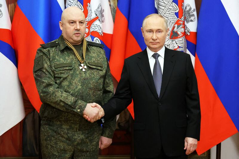 Gen Sergey Surovikin pictured with Russian President Vladimir Putin in 2022. The general has not been seen since Sunday. Reuters