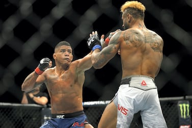 Gilbert Burns of Brazil punches Mike Davis during their lightweight bout at UFC Fight Night in April 2019. AFP