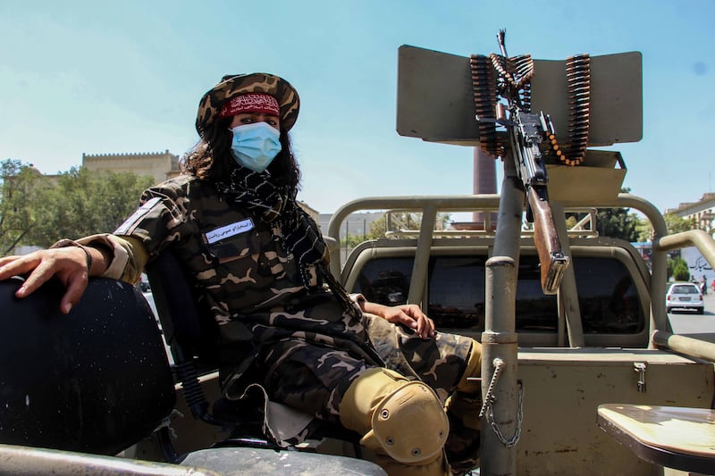 A Taliban fighter with a vehicle-mounted machine gun in Kabul. EPA