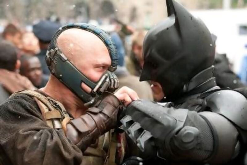 Tom Hardy as Bane and Christian Bale as Batman. Courtesy Warner Bros