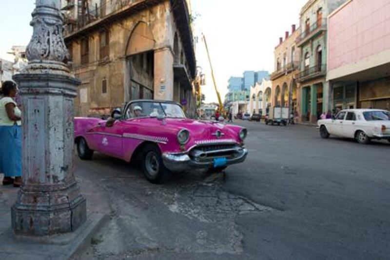 Brightly coloured 1950s American cars still cruise the streets of Old Havana: “Those Chevrolets and Fords are still there, burbling like big beasts in dimly lit roads. Lopsided and creaky, they drive in a time warp.”