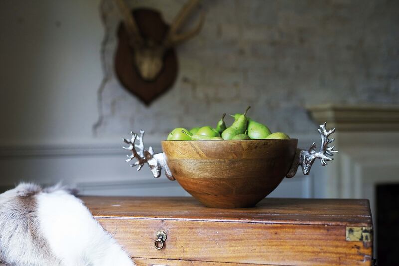 A fruit bowl spilling over with apples and pears. Photo: Annabel James