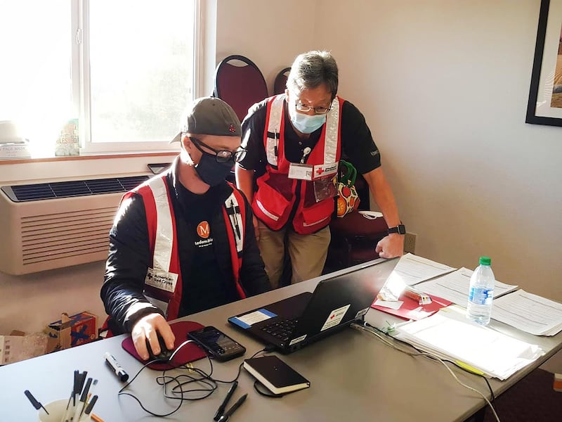 Alan Henzy and an  emergency doctor working in Oregon. Courtesy Red Cross