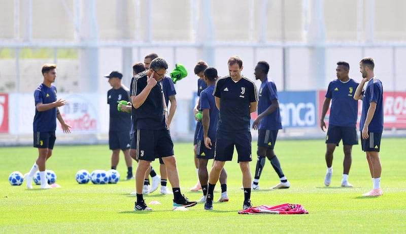 Head coach Massimiliano Allegri, centre right, leads his team's training session. EPA