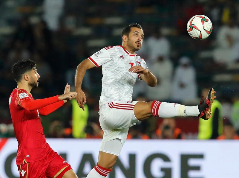 Bahrain's defender Hamed Alshamsan, left, and United Arab Emirates' forward Ali Mabkhout al Hajeri challenge for the ball during the AFC Asian Cup group A soccer match between the United Arab Emirates and Bahrain at Zayed Sport City in Abu Dhabi, United Arab Emirates, Saturday, Jan. 5, 2019. (AP Photo/Hassan Ammar)