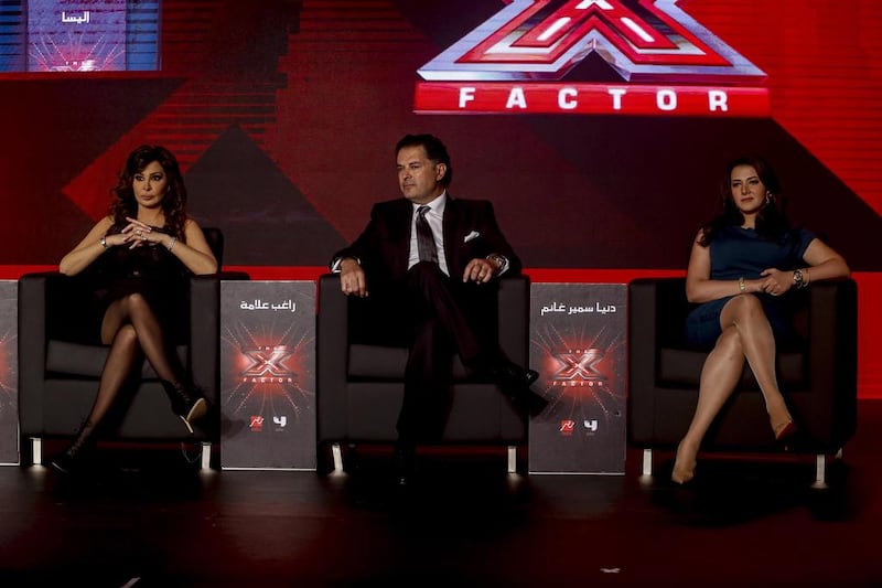 From left, judges Elissa, Ragheb Alama and Donia Ghanem at The X Factor launch in Dubai on March 11. The first episode airs on MBC4 and MBC Masr on March 14. Antonie Robertson / The National